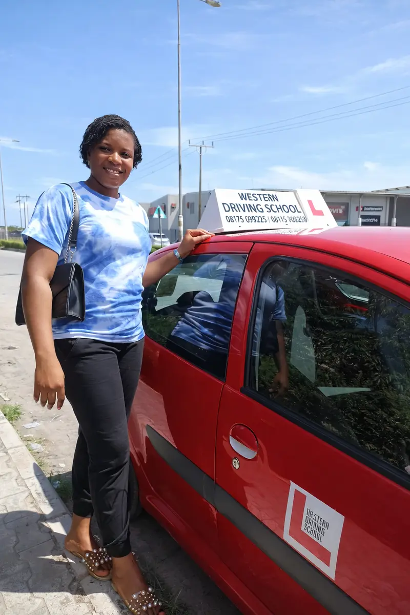 Happy Student with Training Vehicle